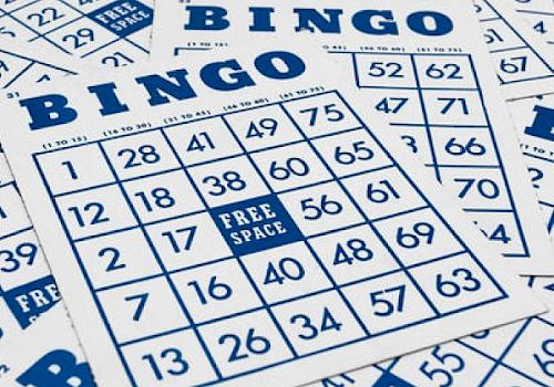 The image shows several Bingo cards, each with a grid of numbers and a free space in the center. The numbers are arranged in columns under BINGO.