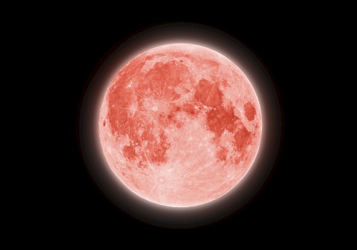 This image shows a blood moon, which is characterized by a reddish tint due to the scattering of sunlight through Earth's atmosphere.