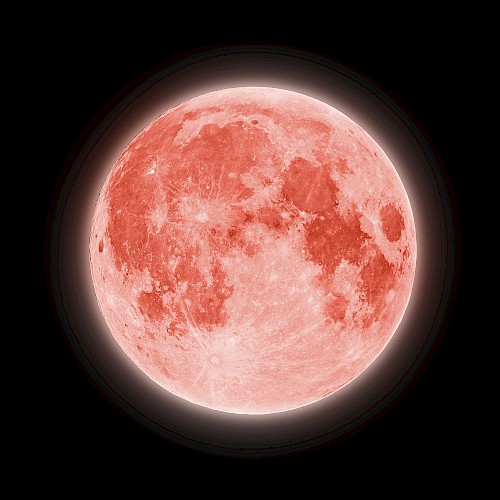 This image shows a blood moon, which is characterized by a reddish tint due to the scattering of sunlight through Earth's atmosphere.